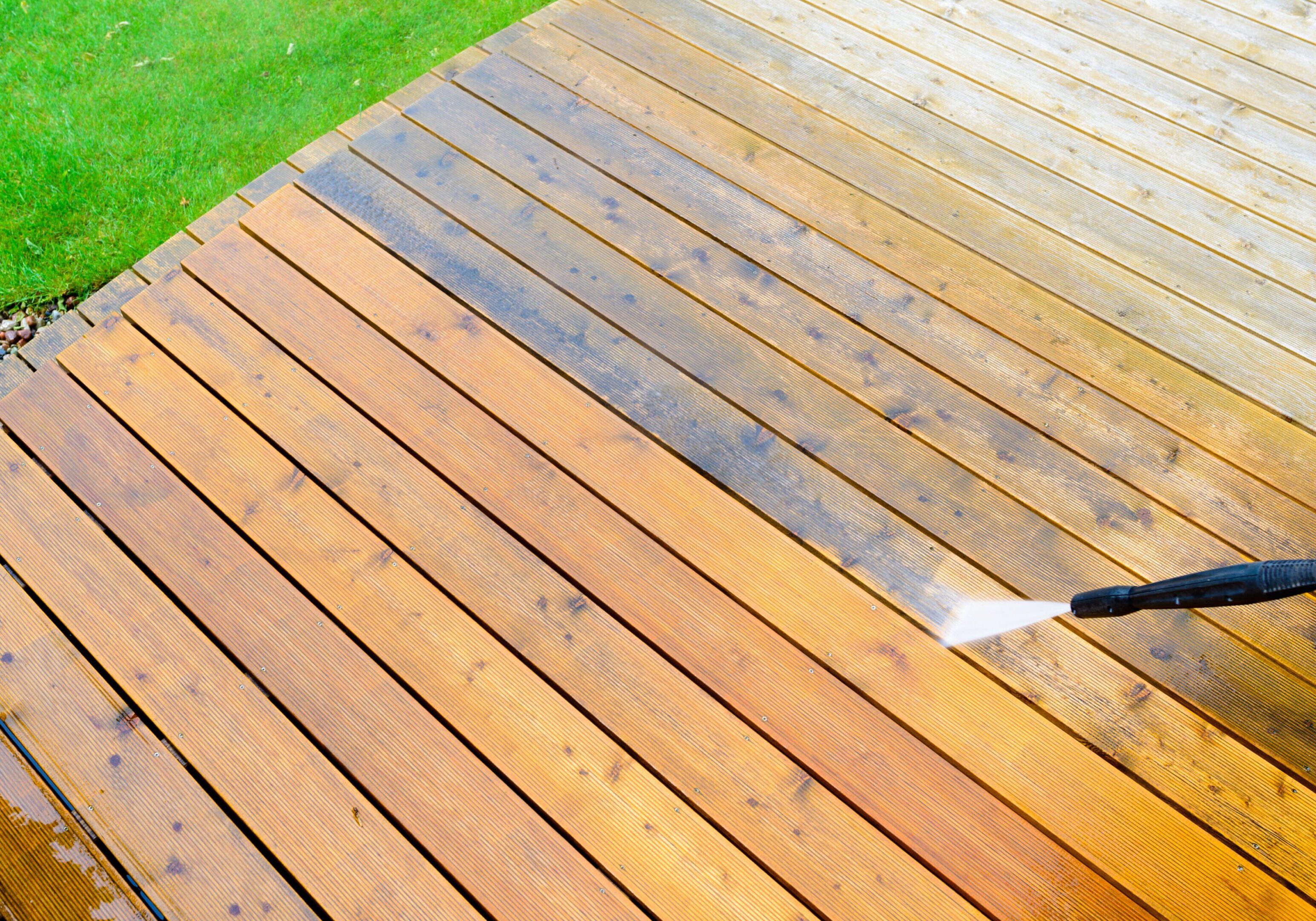 cleaning terrace with a power washer - high water pressure cleaner on wooden terrace surface cleaning terrace with a power washer - high water pressure cleaner on wooden terrace surface